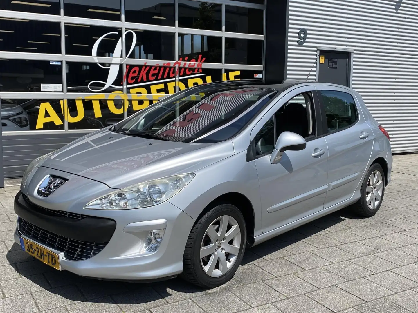 Peugeot 308 1.6- 16 VTi XT - Panorama-dak I Airco I Sport velg Grijs - 1