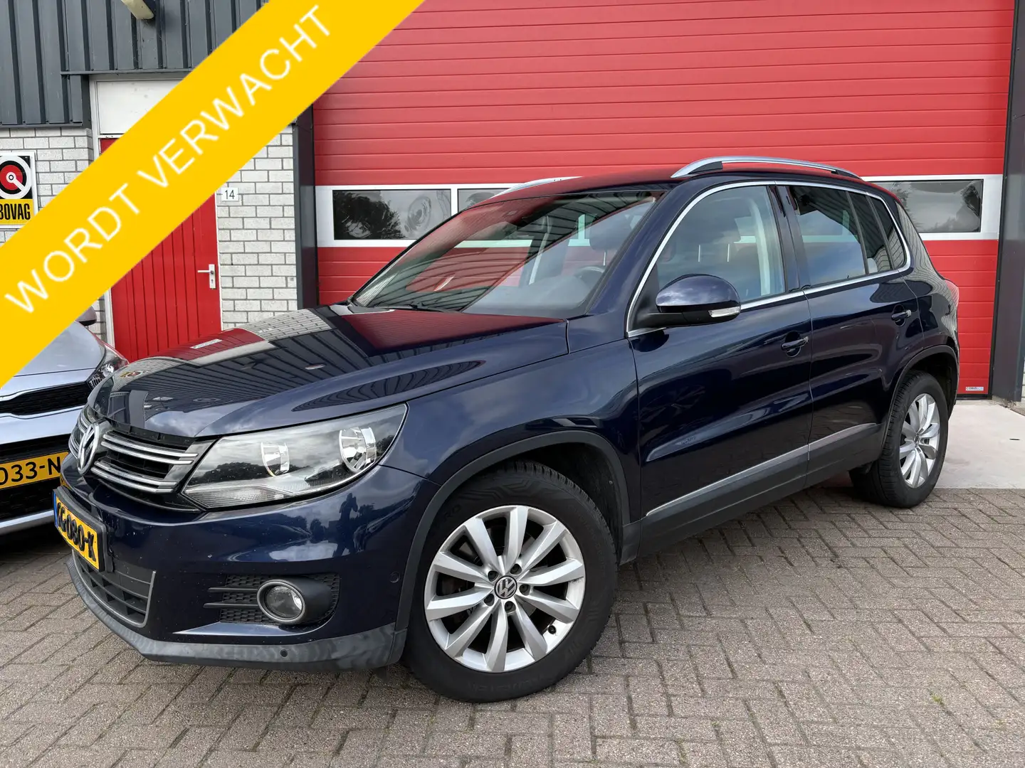 Volkswagen Tiguan 1.4 TSI Sport&Style TREKHAAK / NAVI / CLIMA / PDC Blauw - 1