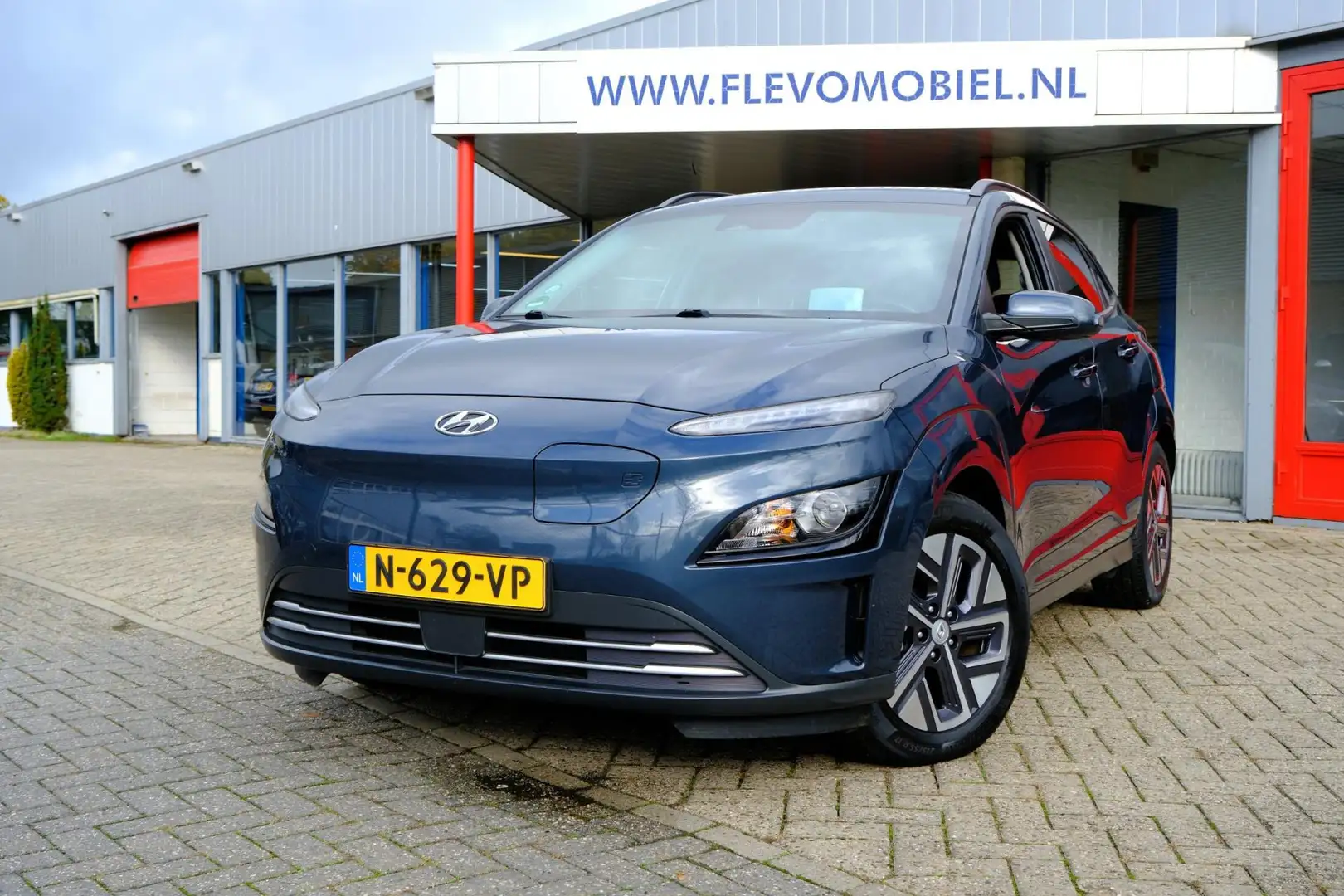 Hyundai KONA EV Fashion 64 kWh Aut. Navi|1e Eig|Clima|Cam|LMV|H Blauw - 1