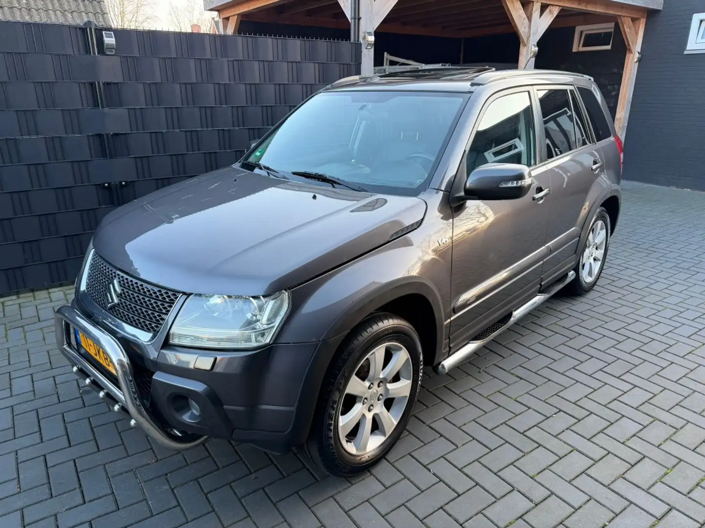 Suzuki Grand Vitara 3.2 V6| AUTOMAAT| 4X4| LEER| CLIMA| TREKHAAK| NAP Grau - 1