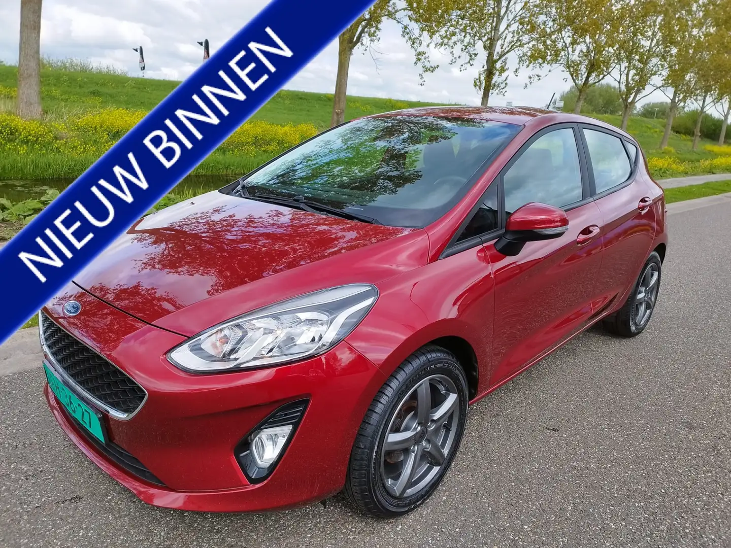 Ford Fiesta 1.1 Trend ** Airco ** Bluetooth ** 86.591 km ** Wi Rood - 1