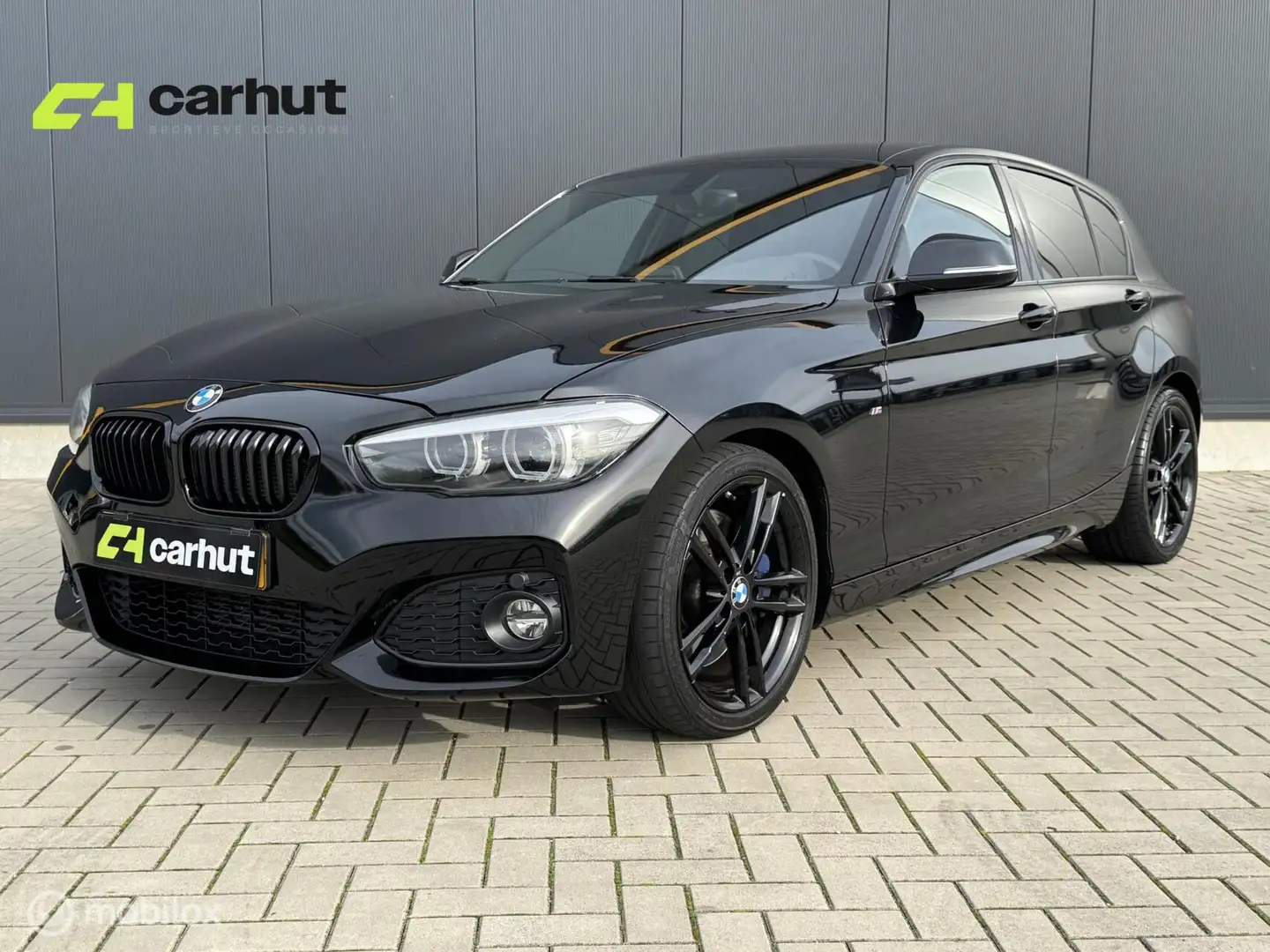 BMW 118 1-serie 118i M Sport, Leer, 18 inch LM, NL auto me Zwart - 1