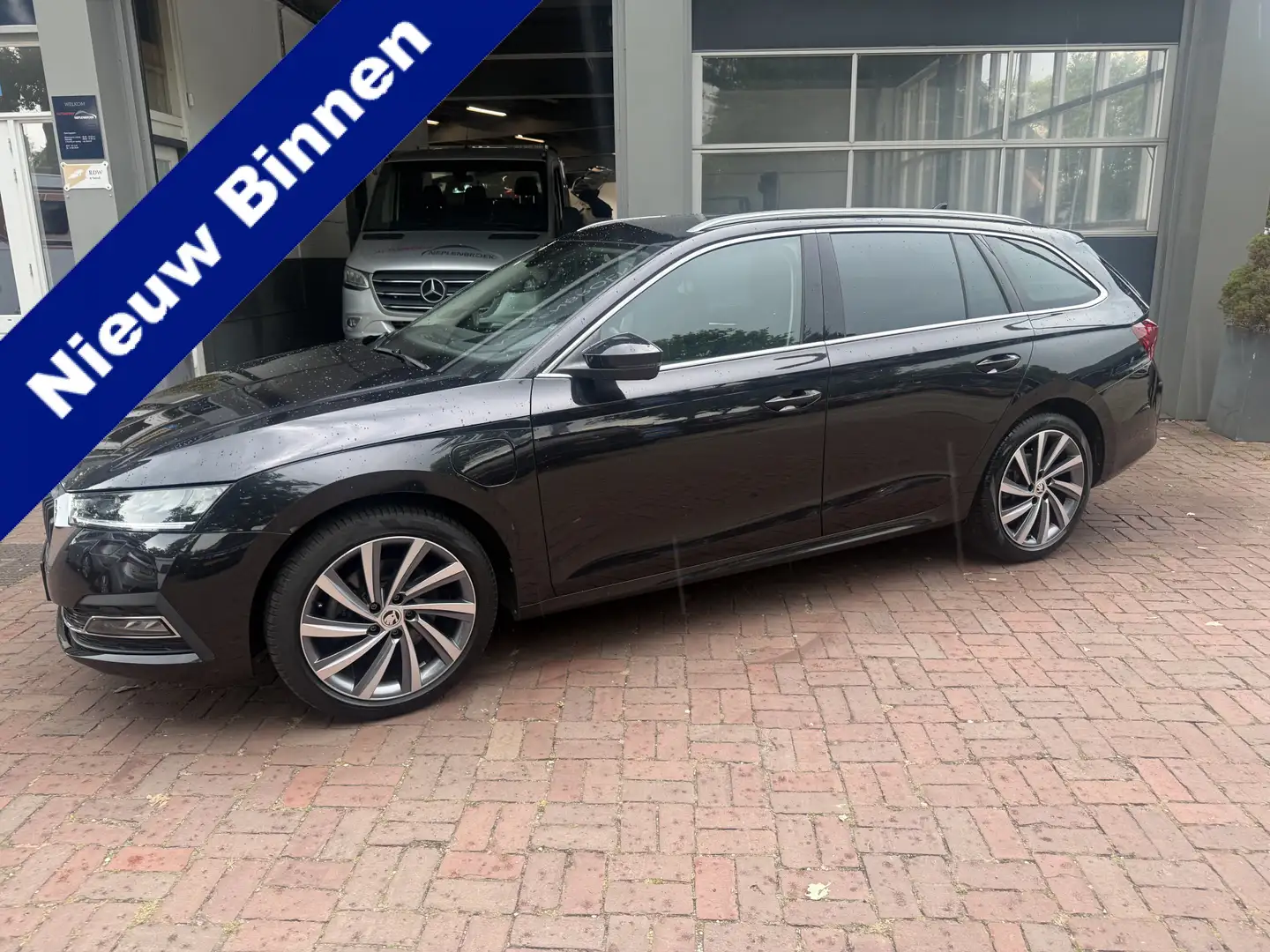 Skoda Octavia Combi 1.4 TSI iV PHEV Sportline Business 07-2021 7 Zwart - 1
