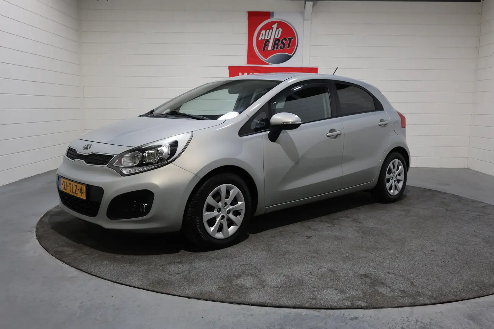 Kia Rio 1.2 CVVT Plus Pack, Airco, All season banden, 1e e Beige - 1