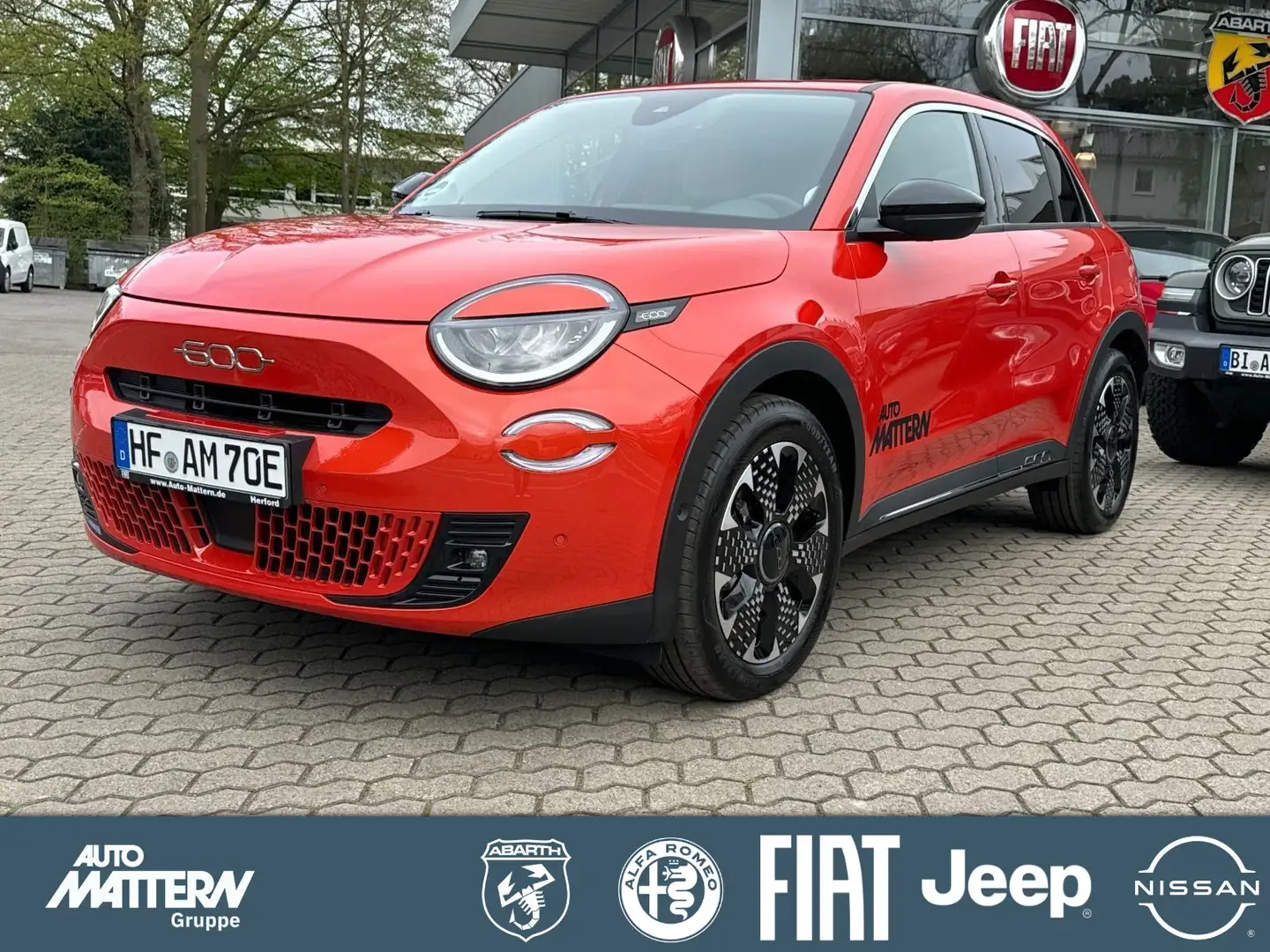 Fiat 600e LaPrima|Klimaaut|ACC|Kamera|NAV|LED|SHZ|Car Orange - 1