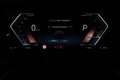 BMW i4 eDrive40 84 kWh | Achteruitrijcamera | DAB | BMW W Zwart - thumbnail 24