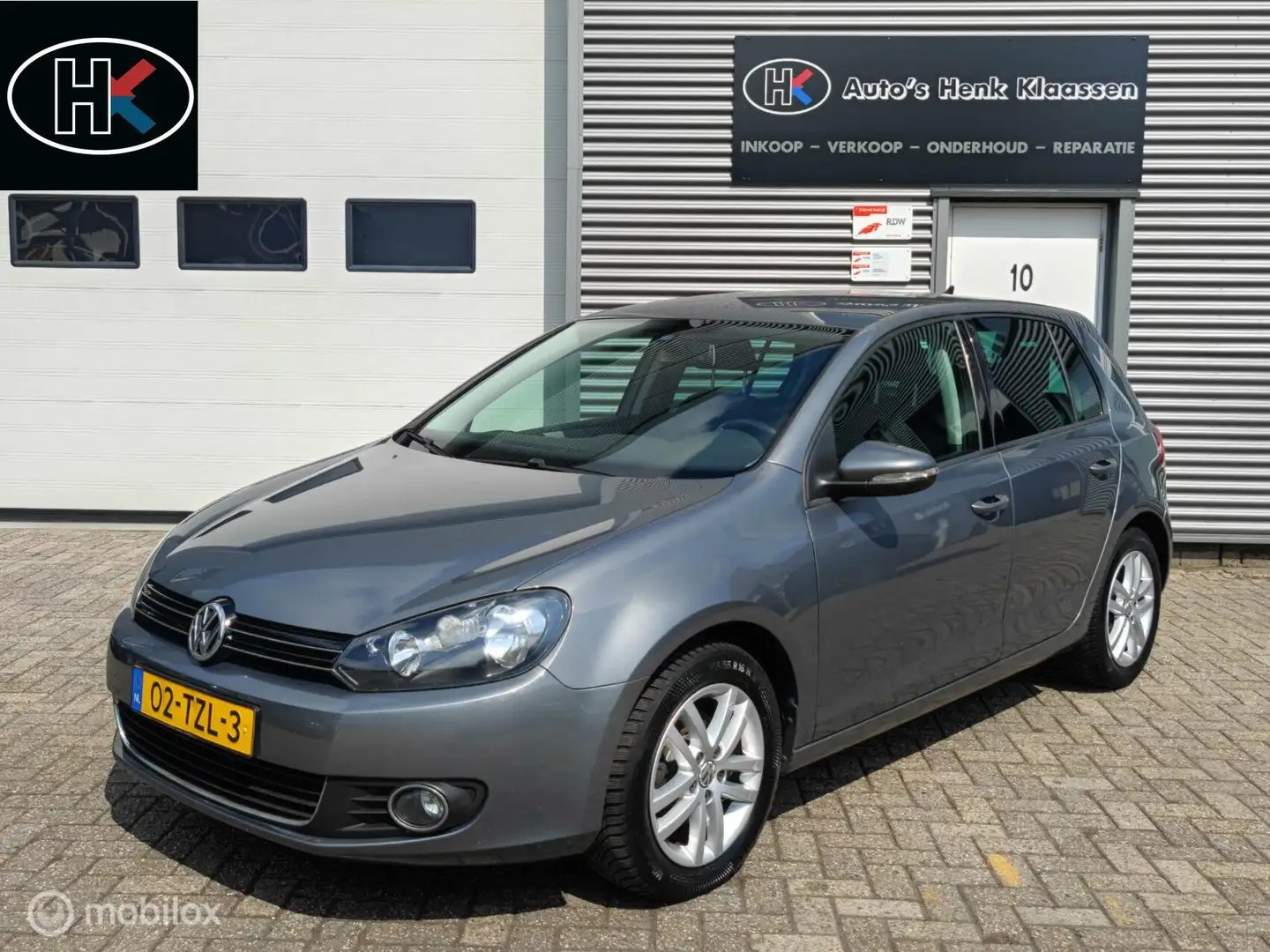 Volkswagen Golf 5-deurs 1.2TSi 105pk H6 Highline Clima Navi Gris - 1