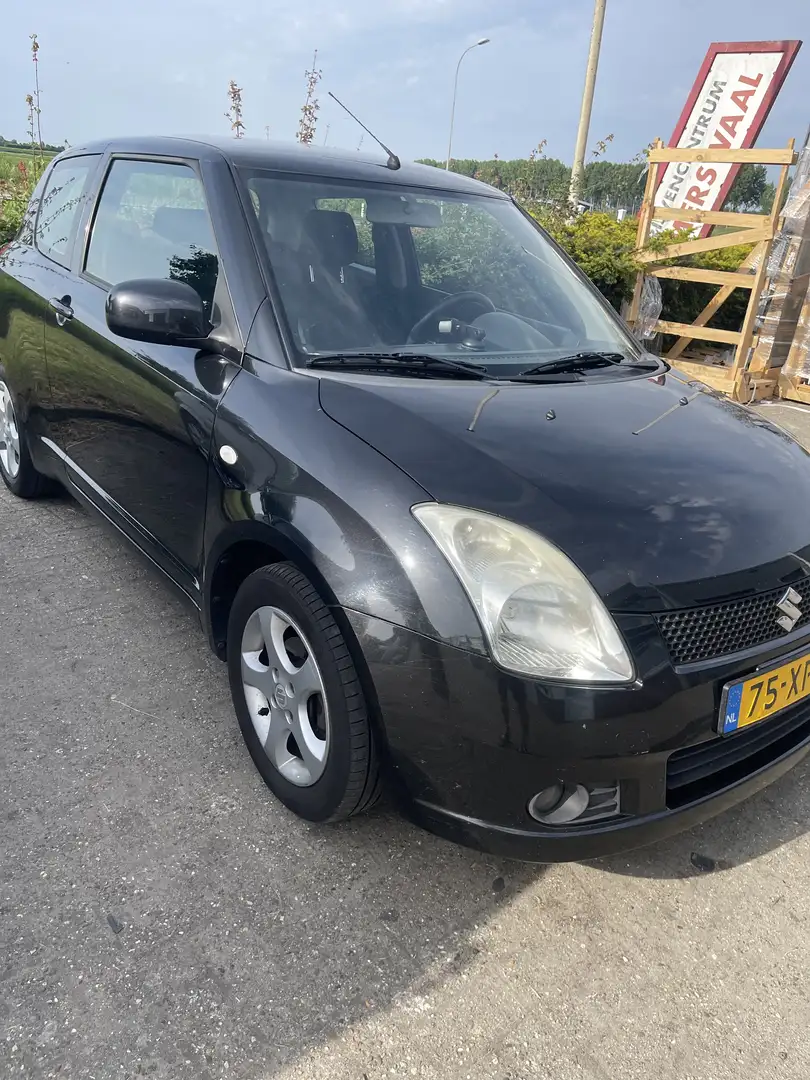 Suzuki Swift 1.3 Exclusive Zwart - 1