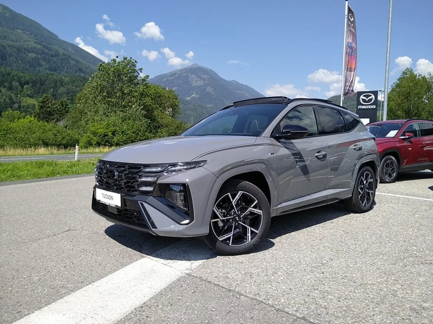 Hyundai TUCSON NX4 N Line 1,6 T-GDi PHEV 4WD AT Matrix-LED Sitzp Pano Smart Grau - 2