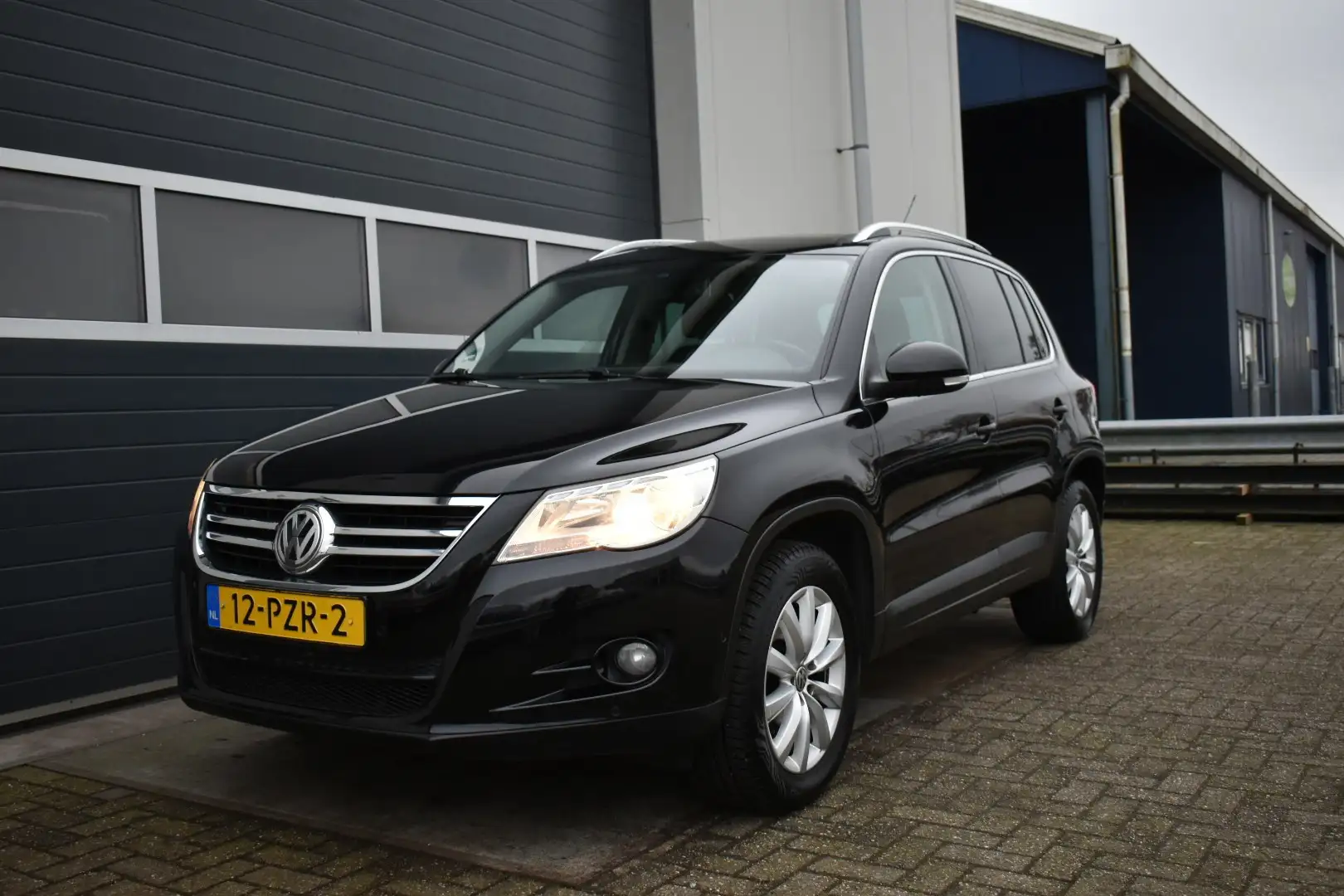 Volkswagen Tiguan 1.4 TSI Sport&Style panoramadak Schwarz - 1