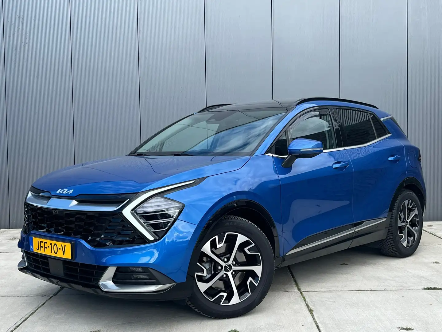 Kia Sportage 1.6 T-GDi MHEV 180PK DynamicPlusLine / Panoramadak Blauw - 1