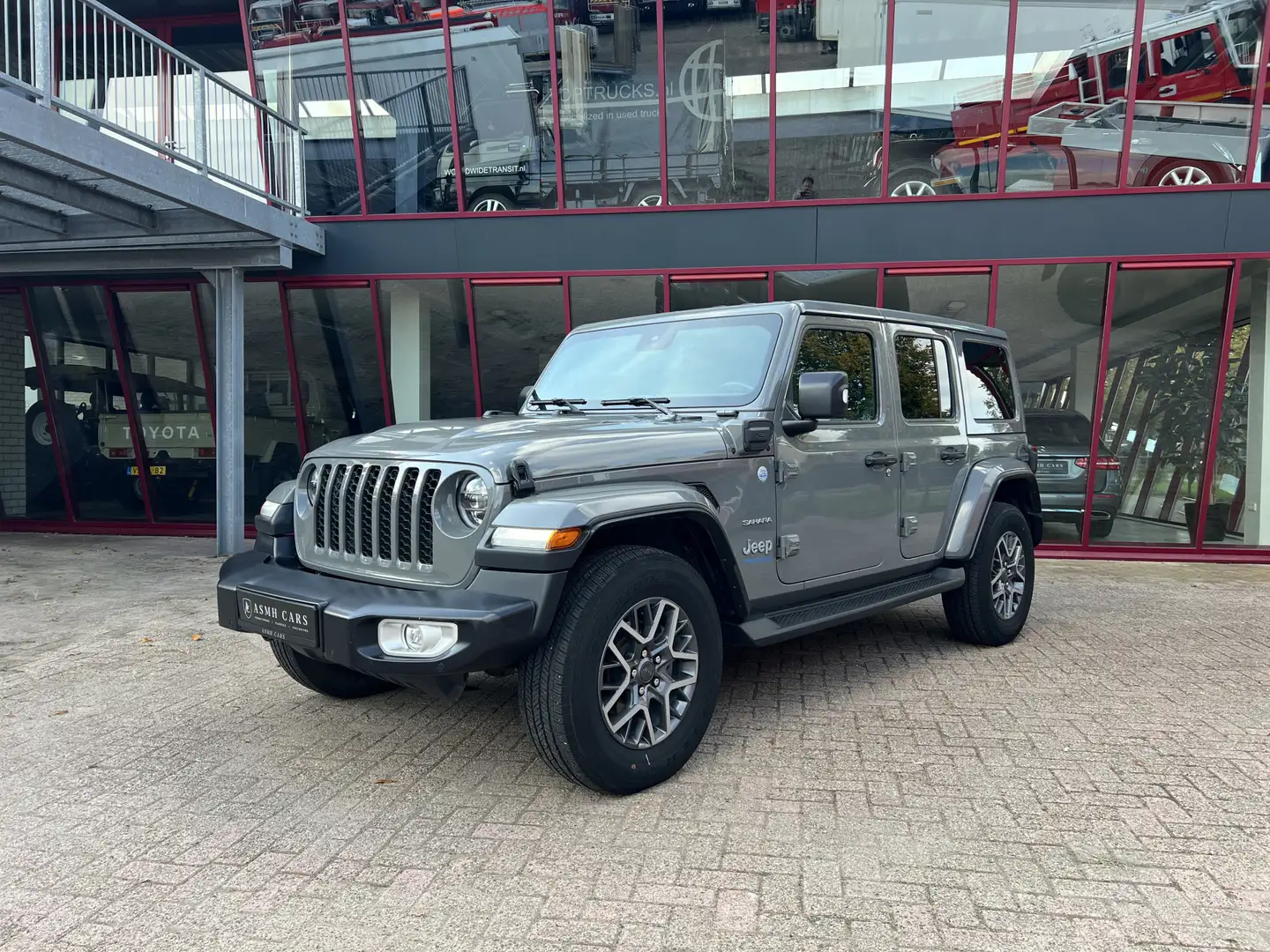 Jeep Wrangler Unlimited 4xe 380 Sahara | Leder | Navi | ACC | St Gris - 1