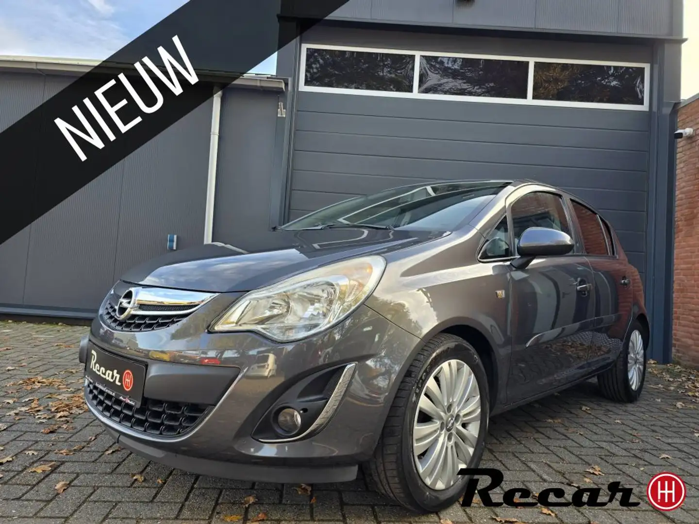 Opel Corsa 1.4-16V Cosmo/1eEig/5Drs/Navi/Airco/Cruise Grijs - 1