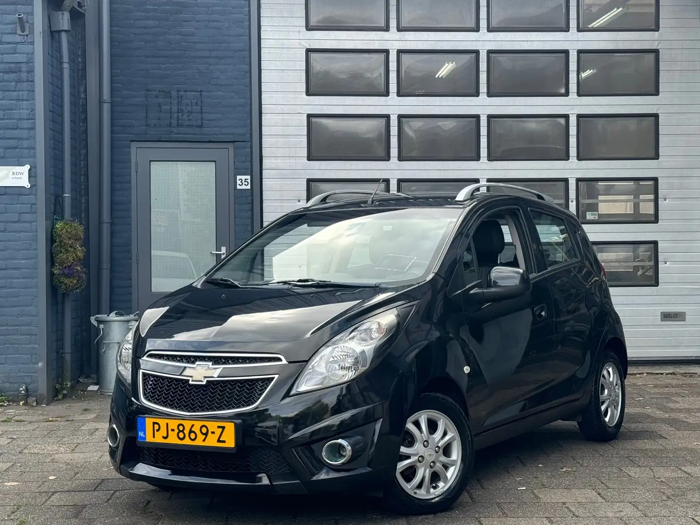 Chevrolet Spark 1.2 16V LTZ | Airco | LMV | 90000 DKM Zwart - 1