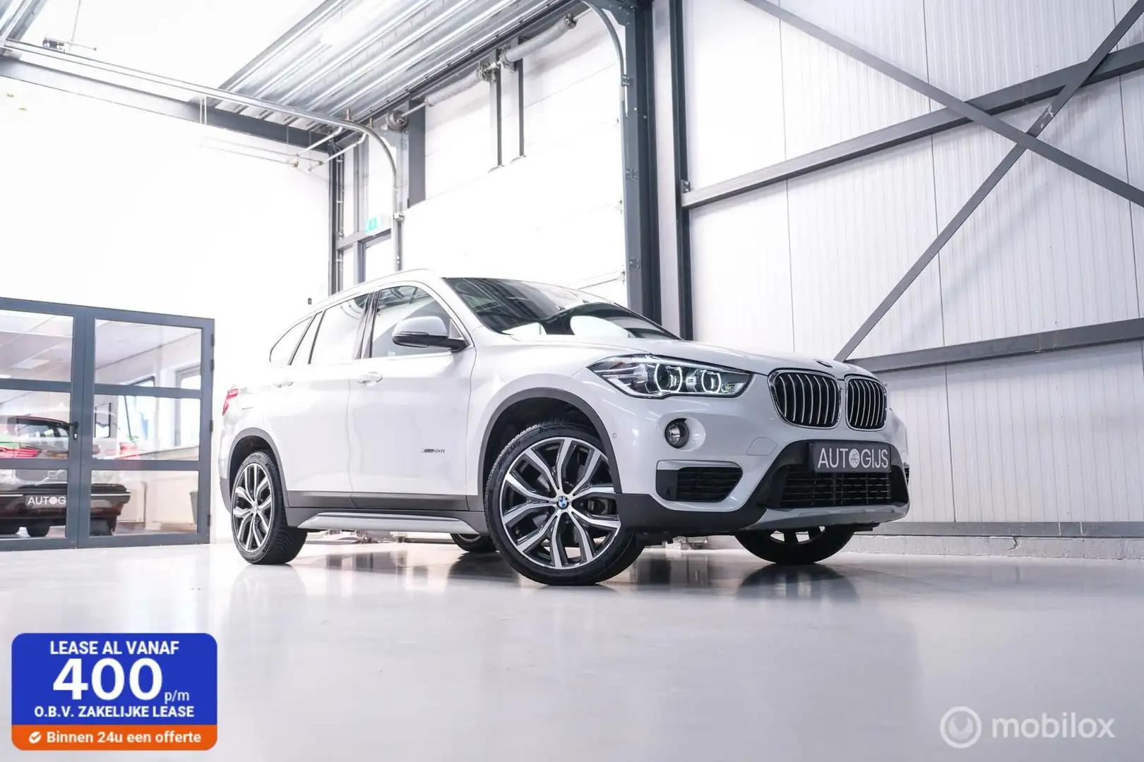 BMW X1 xDrive20i High Executive | 4x4 | HUD | Trekhaak | Blanc - 1