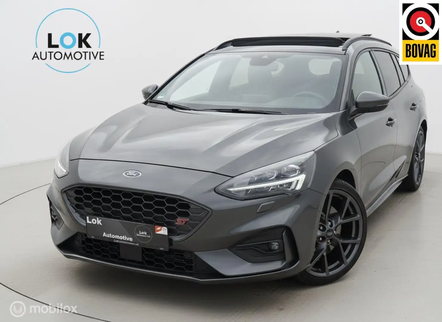 Ford Focus 2.3 EcoBoost ST-3 PANO|B&O|KEYLESS|CAMERA|280PK| Grijs - 1