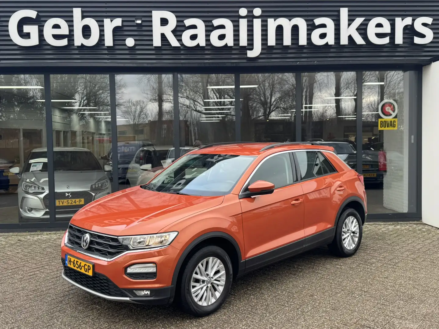 Volkswagen T-Roc 1.0 TSI Style *Navigatie*Stoelverwarming* Orange - 1