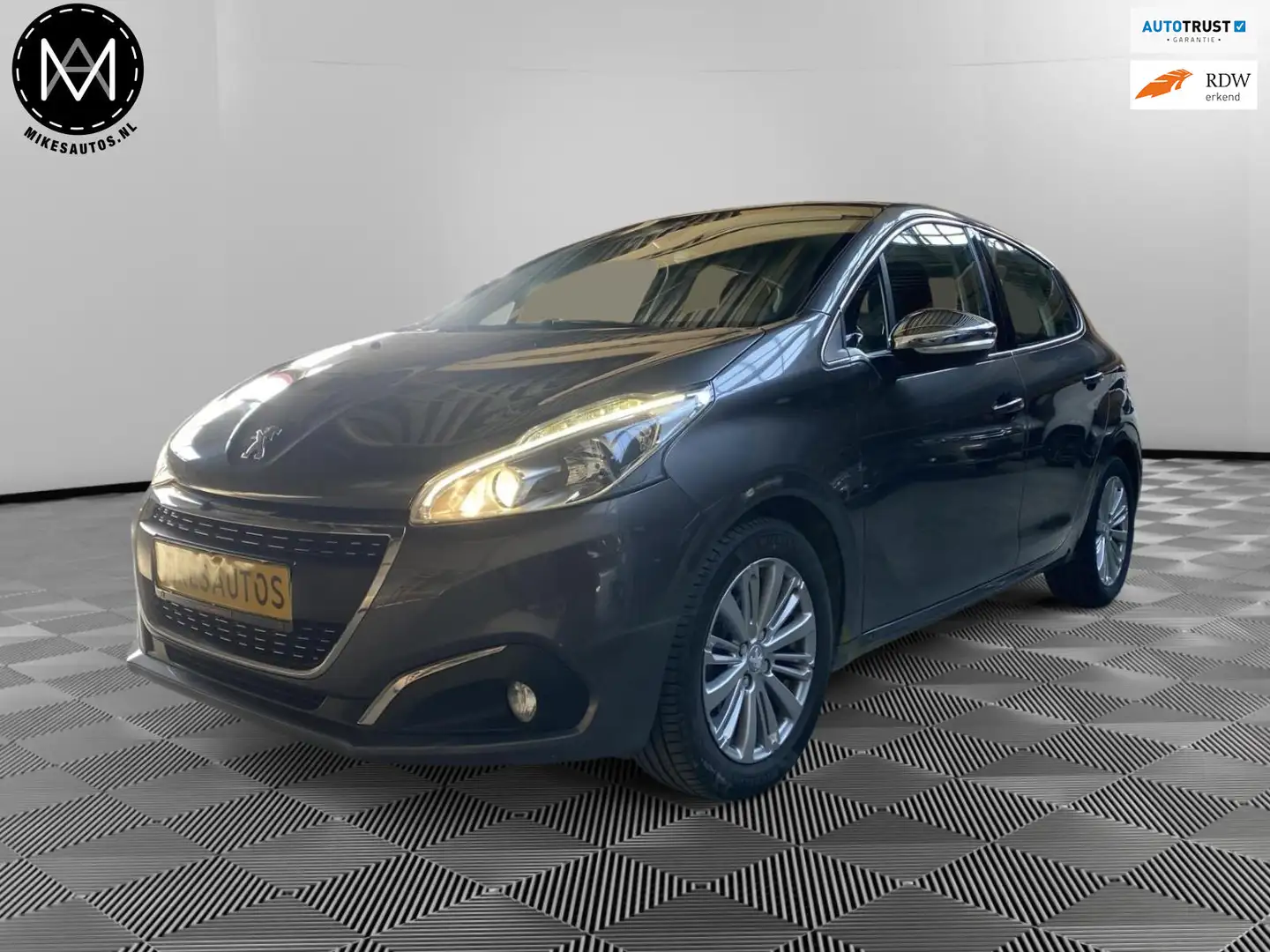Peugeot 208 1.2 PureTech Nieuwe Distributie +12 Mnd garantie Grijs - 1