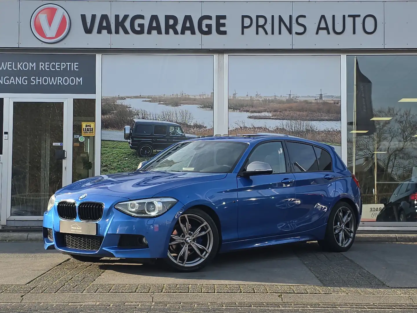 BMW 116 1-serie 116i M Sport |PANO|ESTORIL BLUE|M135i|STOE Blauw - 1