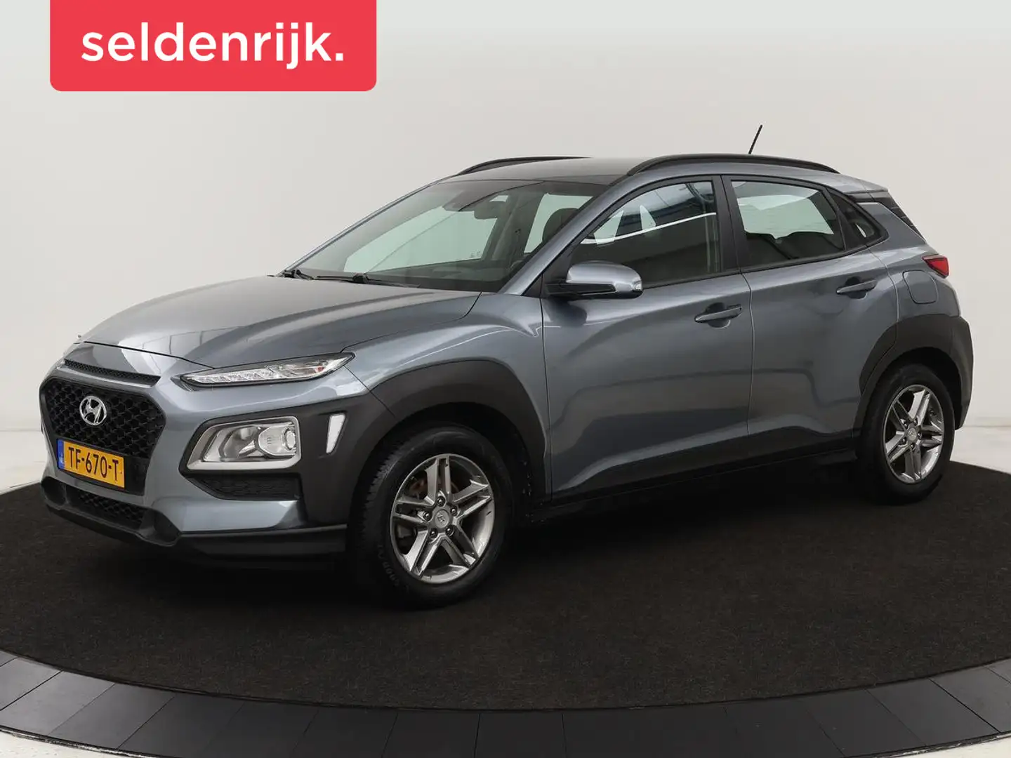 Hyundai KONA 1.0T Comfort | 1e eigenaar | Carplay | Trekhaak | Grijs - 1