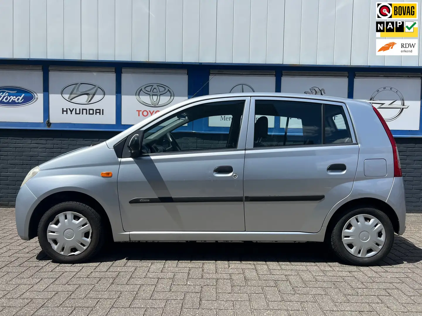 Daihatsu Cuore 1.0-12V Nagano 5DRS.AUTOMAAT 10-2004 2850EU Grijs - 1