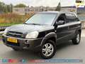 Hyundai TUCSON 2.0i Dynamic | Airco | Cruise | PDC | APK '26 | Tr Zwart - thumbnail 1