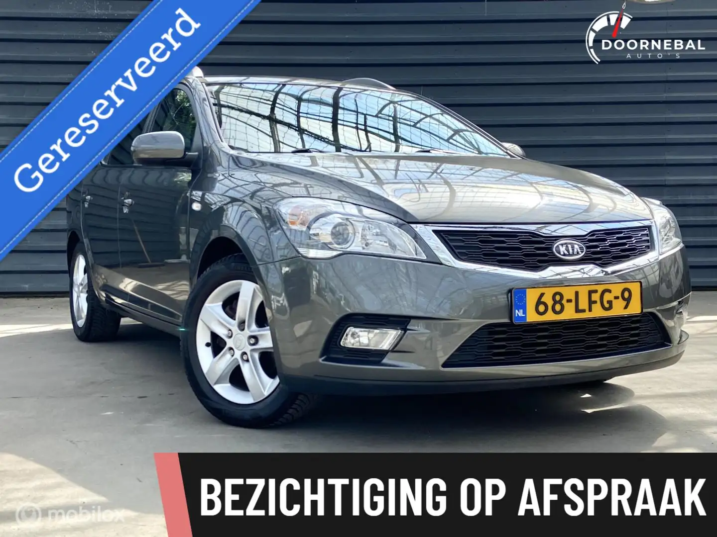 Kia Ceed / cee'd Sporty Wagon 1.4 CVVT X-ecutive Grijs - 1