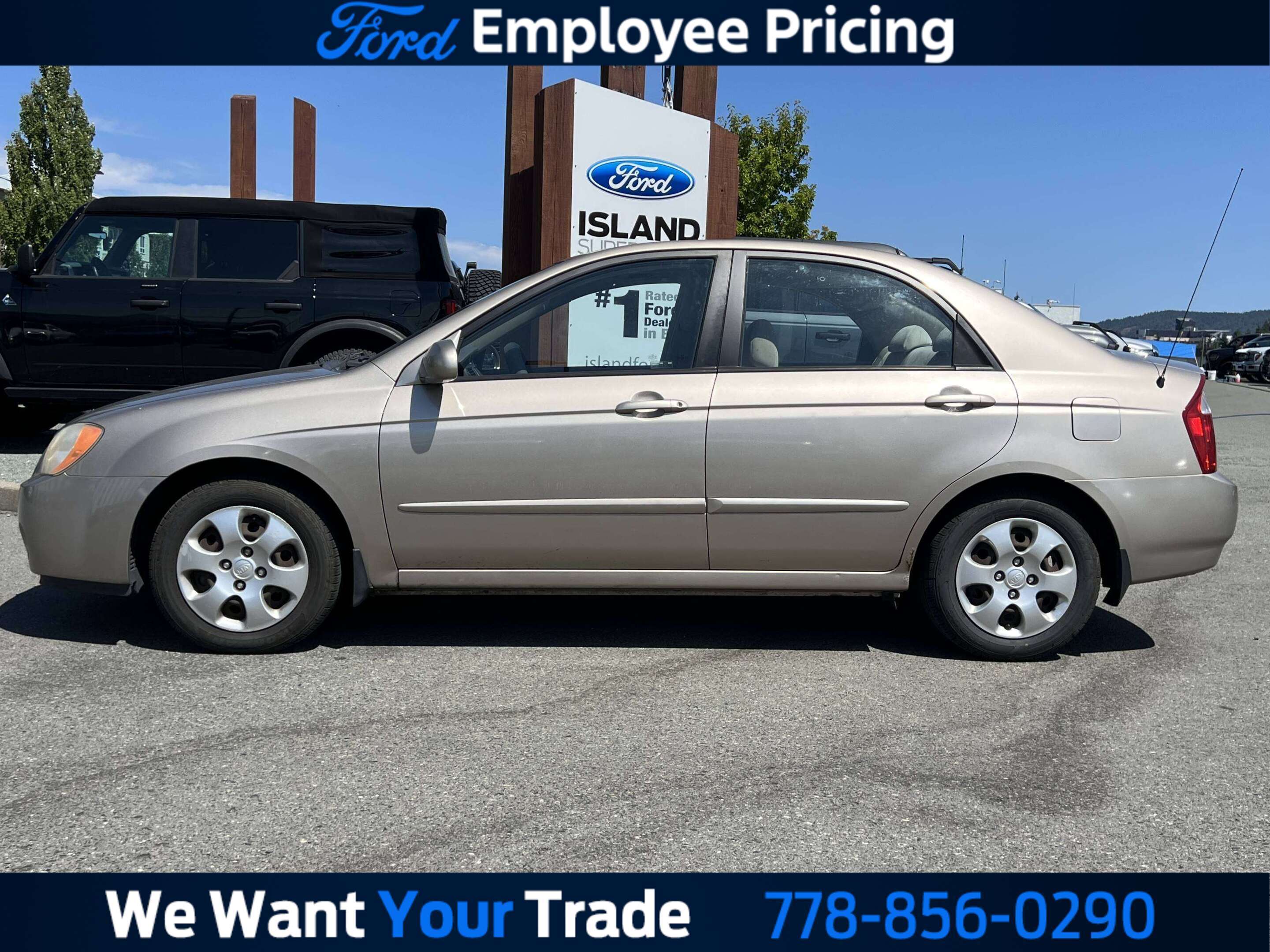 Black 2005 Kia Spectra Sedan Front-Wheel Drive Automatic