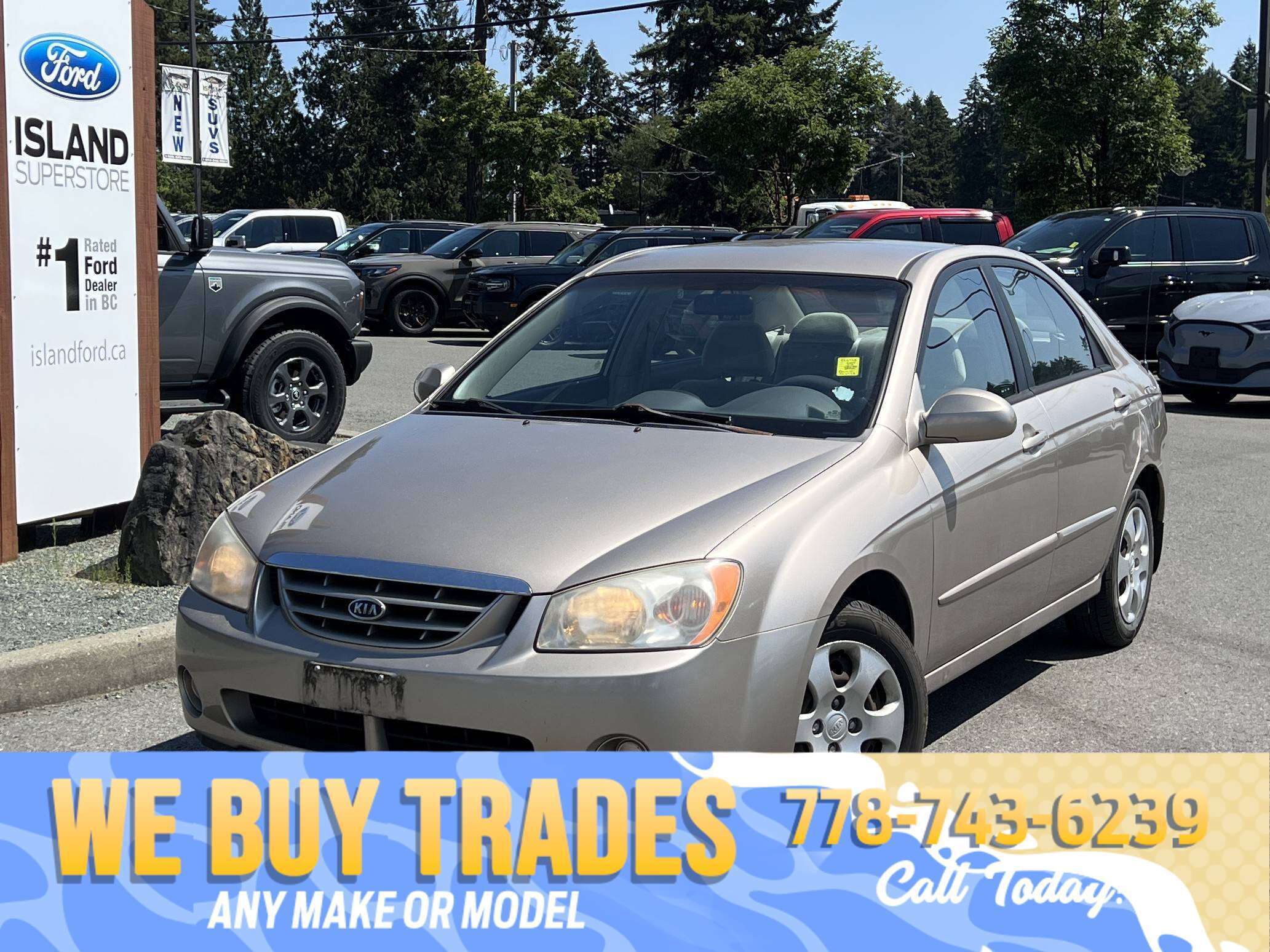 Black 2005 Kia Spectra Sedan Front-Wheel Drive Automatic