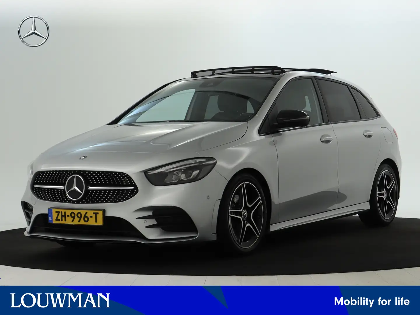 Mercedes-Benz B 180 AMG Nightpakket | Panoramadak | Trekhaak | Parkeer Grijs - 1