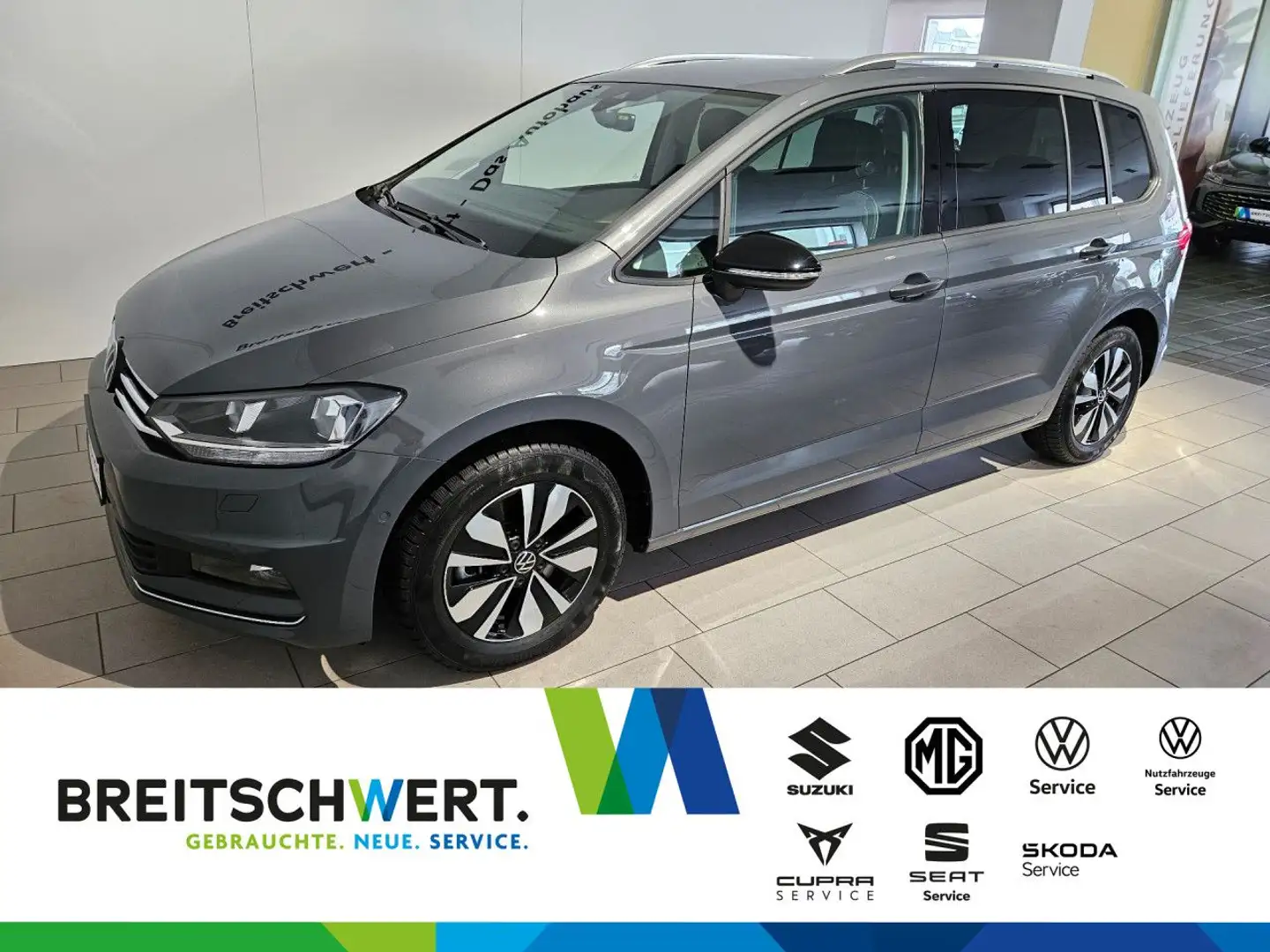 Volkswagen Touran 1.5 TSI Goal DSG RFK Nav Standhzg el.Heckkl Grijs - 1