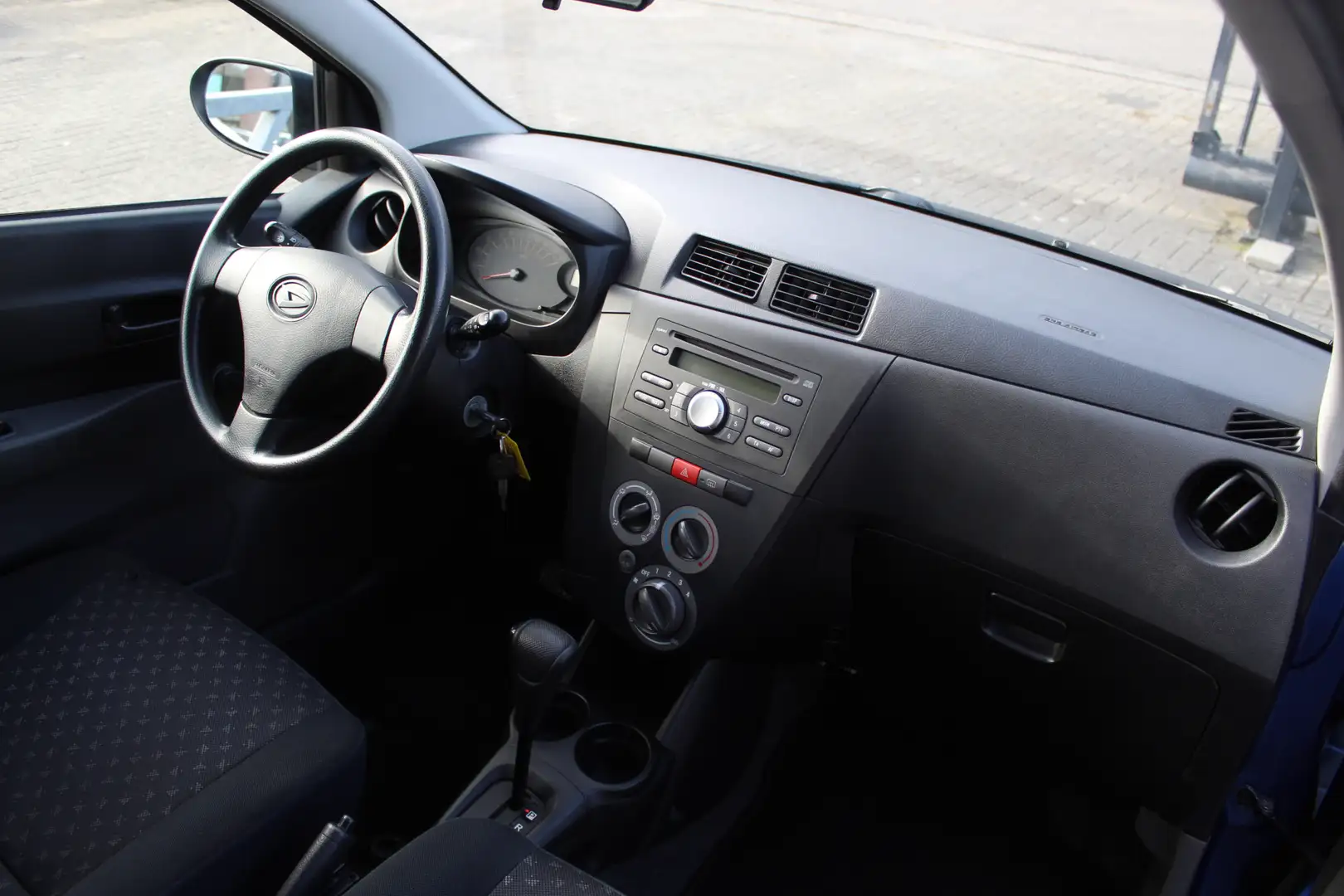 Daihatsu Cuore 1.0 Premium Automaat/Airco/Stuurbekrachtiging/Bump Blau - 2