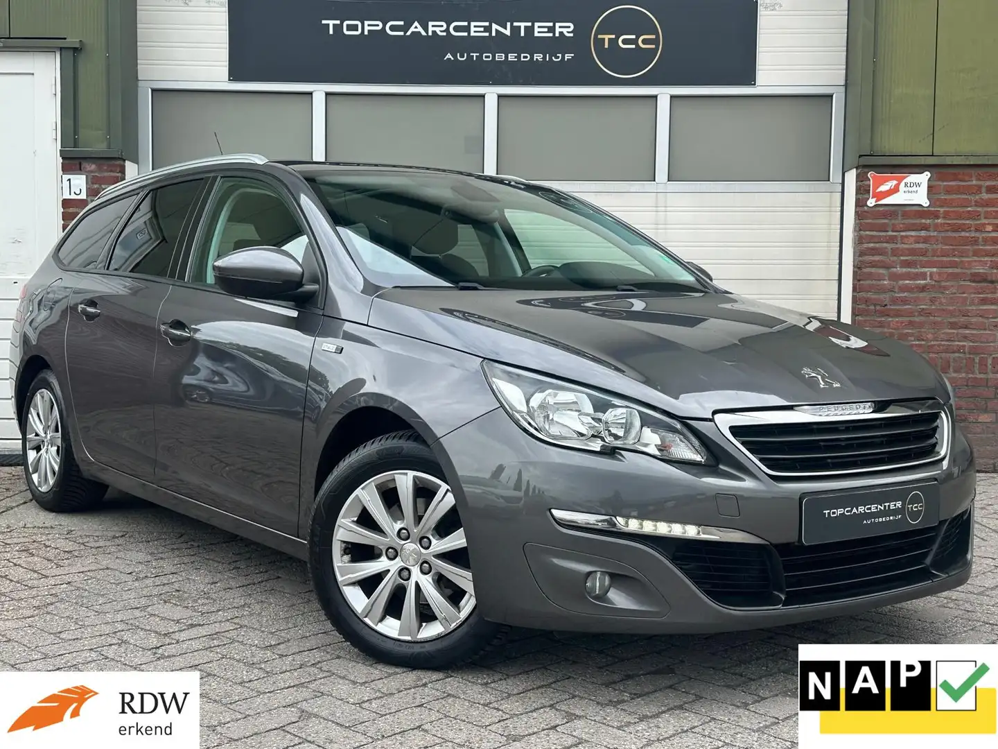 Peugeot 308 SW 1.2 Style/AIRCO/PANO/PARKS/CRUISE/APK/NAP Grau - 1