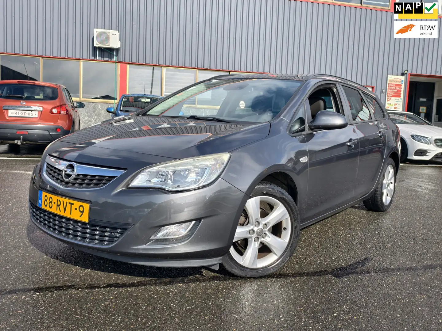 Opel Astra Sports Tourer 1.4 Edition / NAP / AIRCO / SP VLG / Grijs - 1