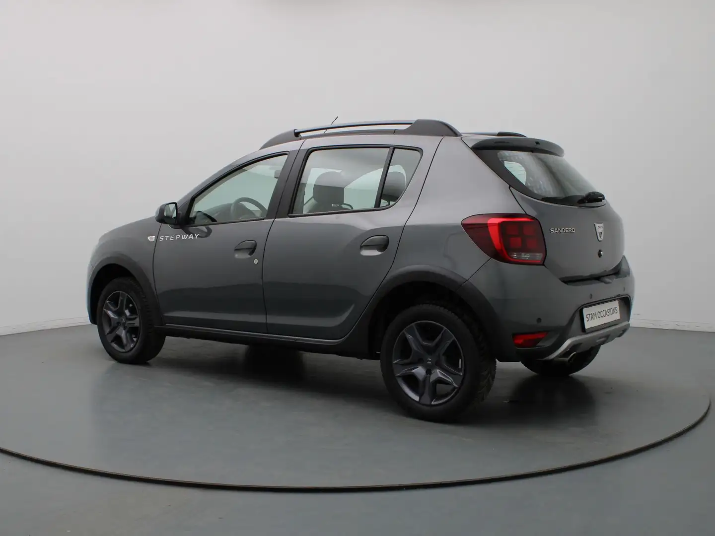 Dacia Sandero 90pk TCe SL Stepway Airco | Cruise | Navi | Parkee Grijs - 2