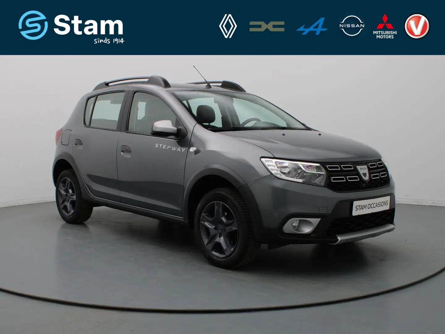 Dacia Sandero 90pk TCe SL Stepway Airco | Cruise | Navi | Parkee Grijs - 1