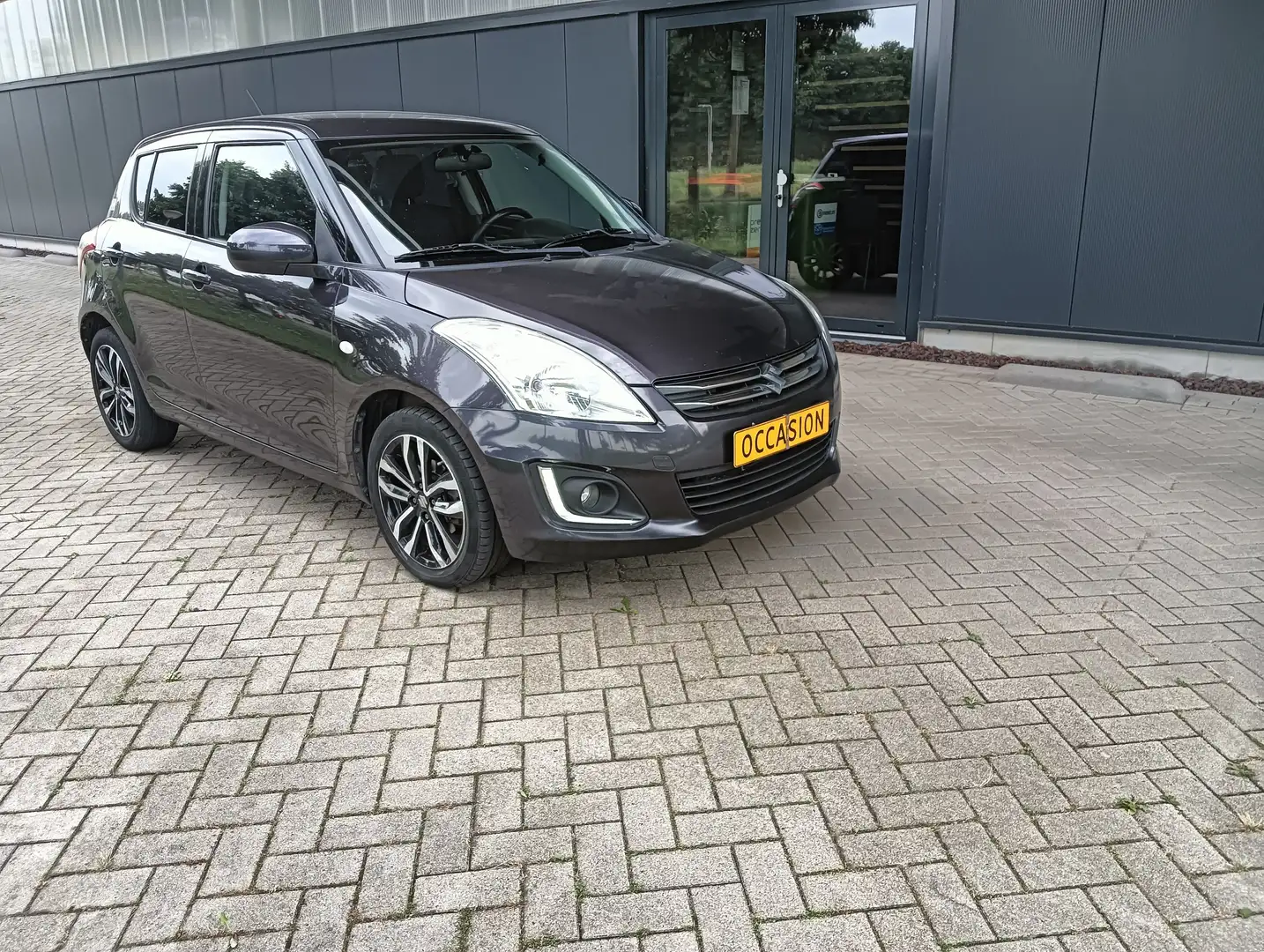 Suzuki Swift STYLE. navigatie. cruise control. stoelverwarming. - 1