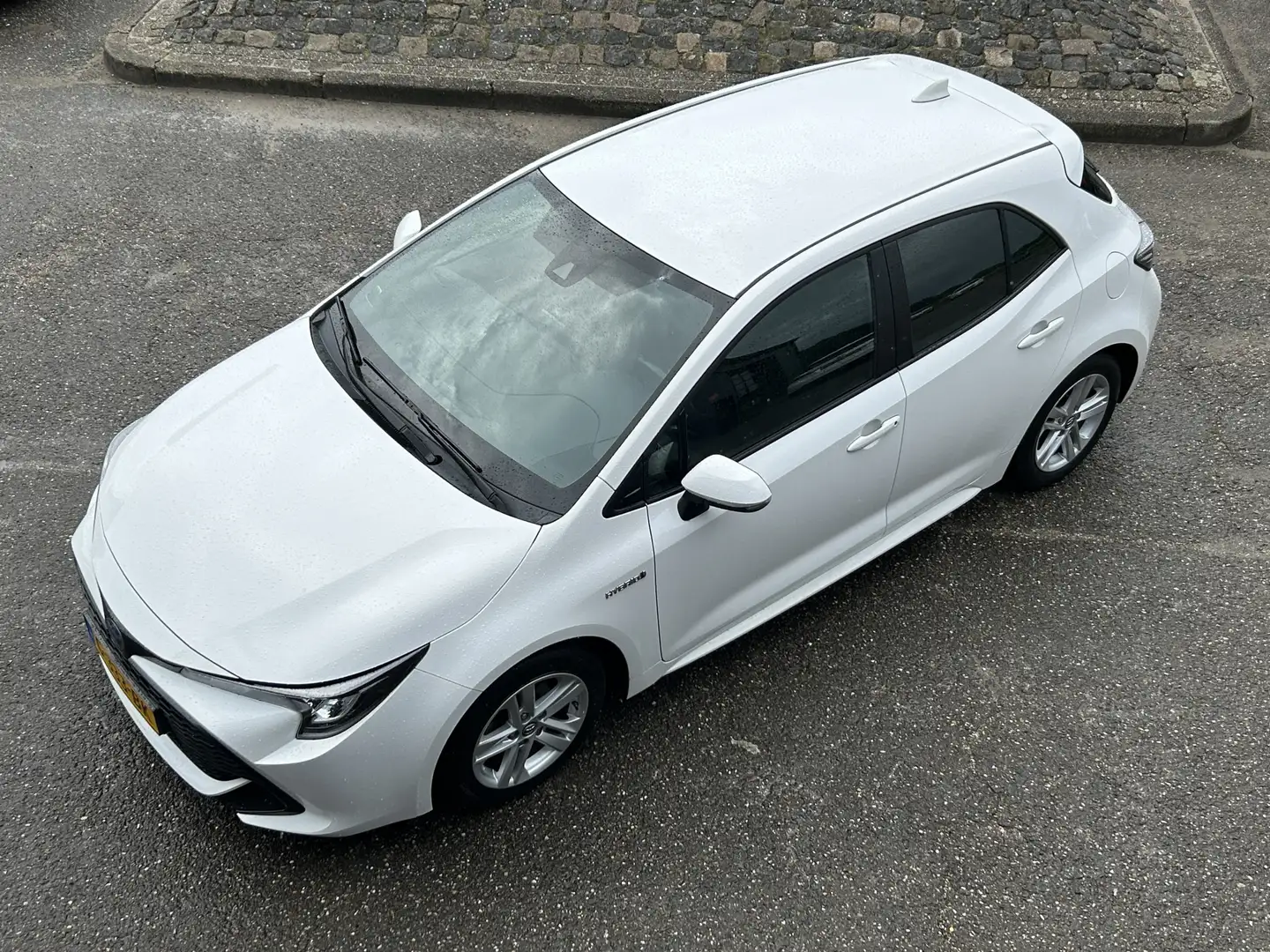 Toyota Corolla 1.8 Hybrid Active 1e EIGENAAR CAMERA LED NAVI CRUI Wit - 2