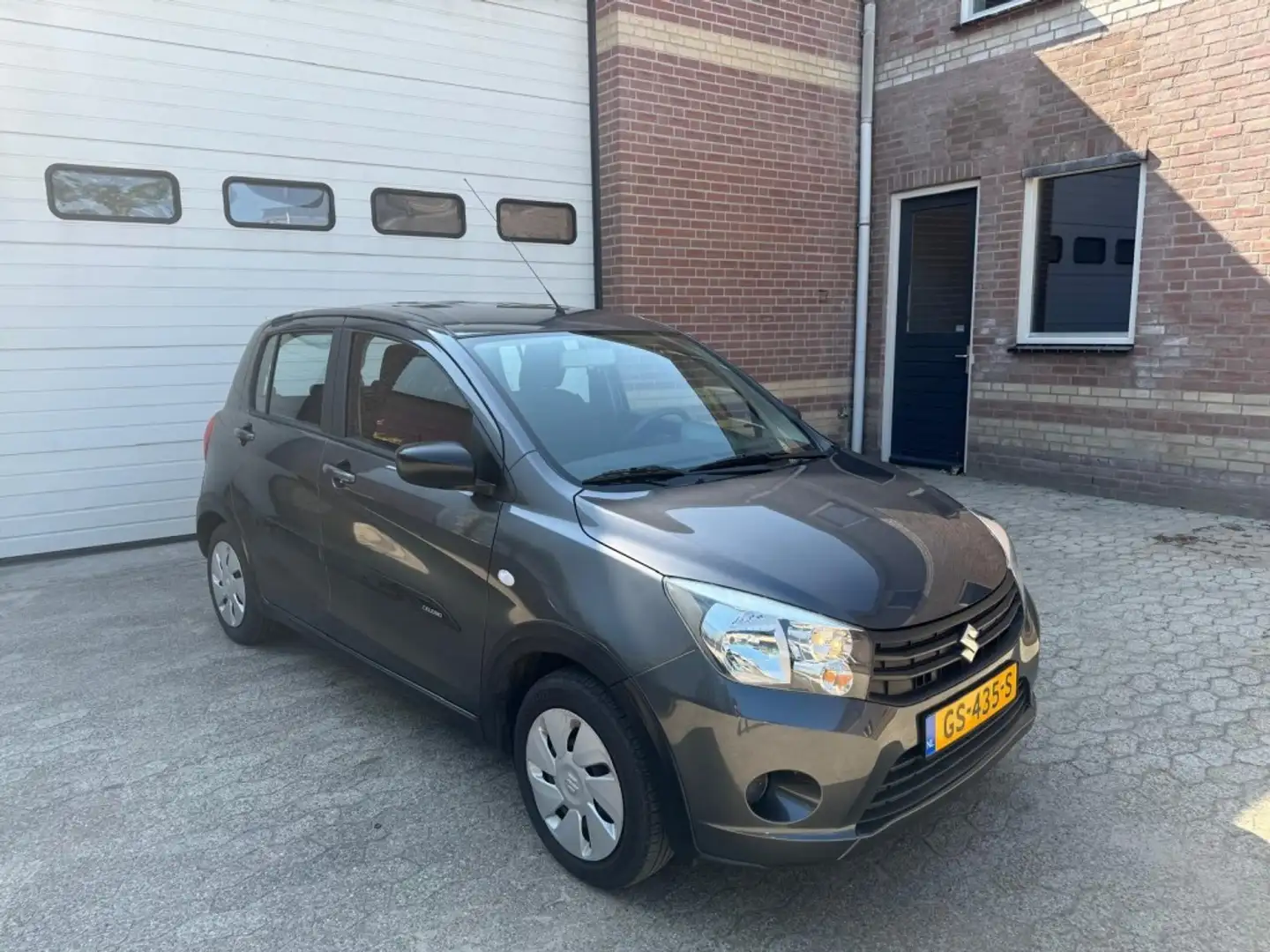 Suzuki Celerio 1.0 automaat airco 1e eigenaar NAP Gris - 1