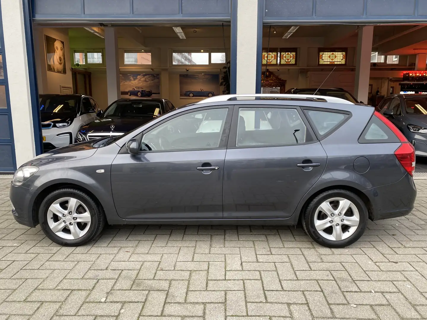 Kia Ceed / cee'd Sporty Wagon 1.4 CVVT Seven NAVI/AIRCO/CRUISE/NAP Grijs - 2