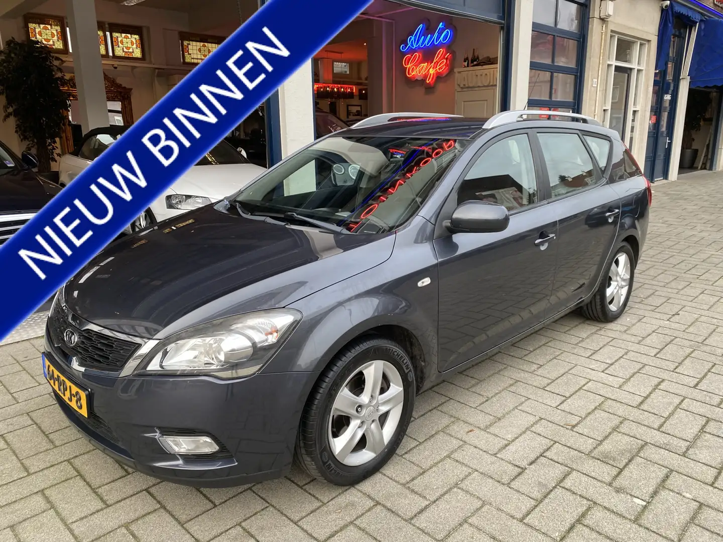 Kia Ceed / cee'd Sporty Wagon 1.4 CVVT Seven NAVI/AIRCO/CRUISE/NAP Grijs - 1