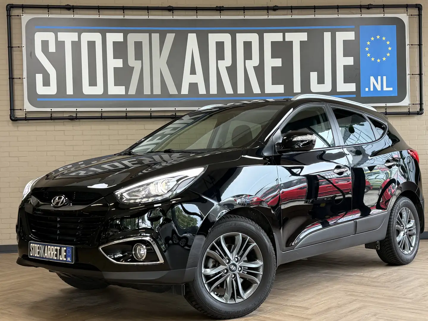 Hyundai iX35 1.6i 135PK i-Catcher Navi | Xenon | Clima | PCD | Zwart - 1