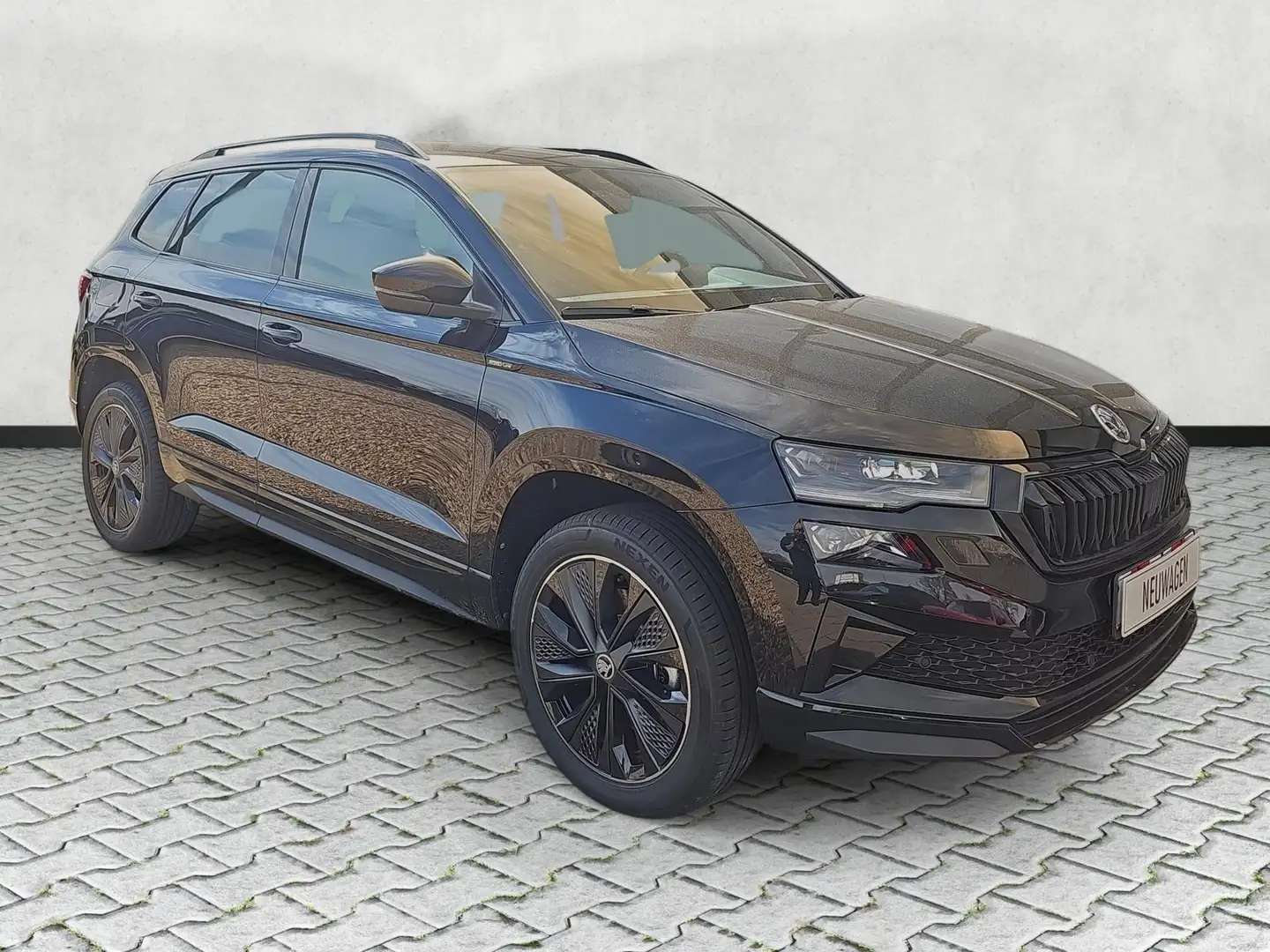 Skoda Karoq Sportline 1.5 TSI DSG 5J.Gar Kessy Matrix 110 k... Schwarz - 1