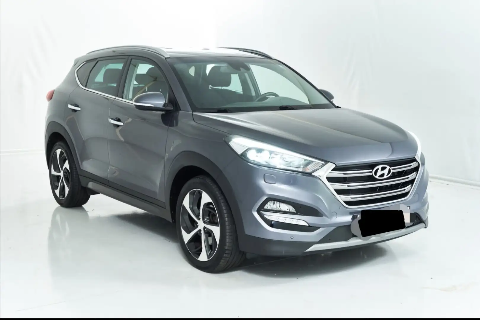 Hyundai TUCSON 2,0 CRDI 4WD Style Aut. Grau - 1