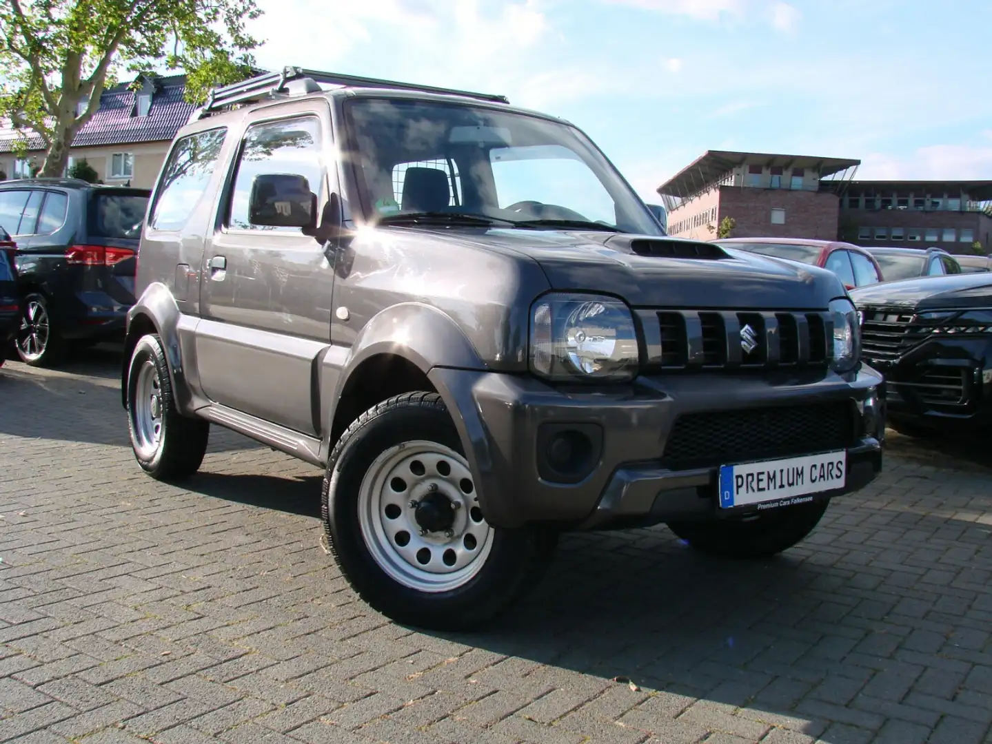 Suzuki Jimny 1.3 Allgrip 4-Sitzer Klima Sitzheizung AHK Grau - 1