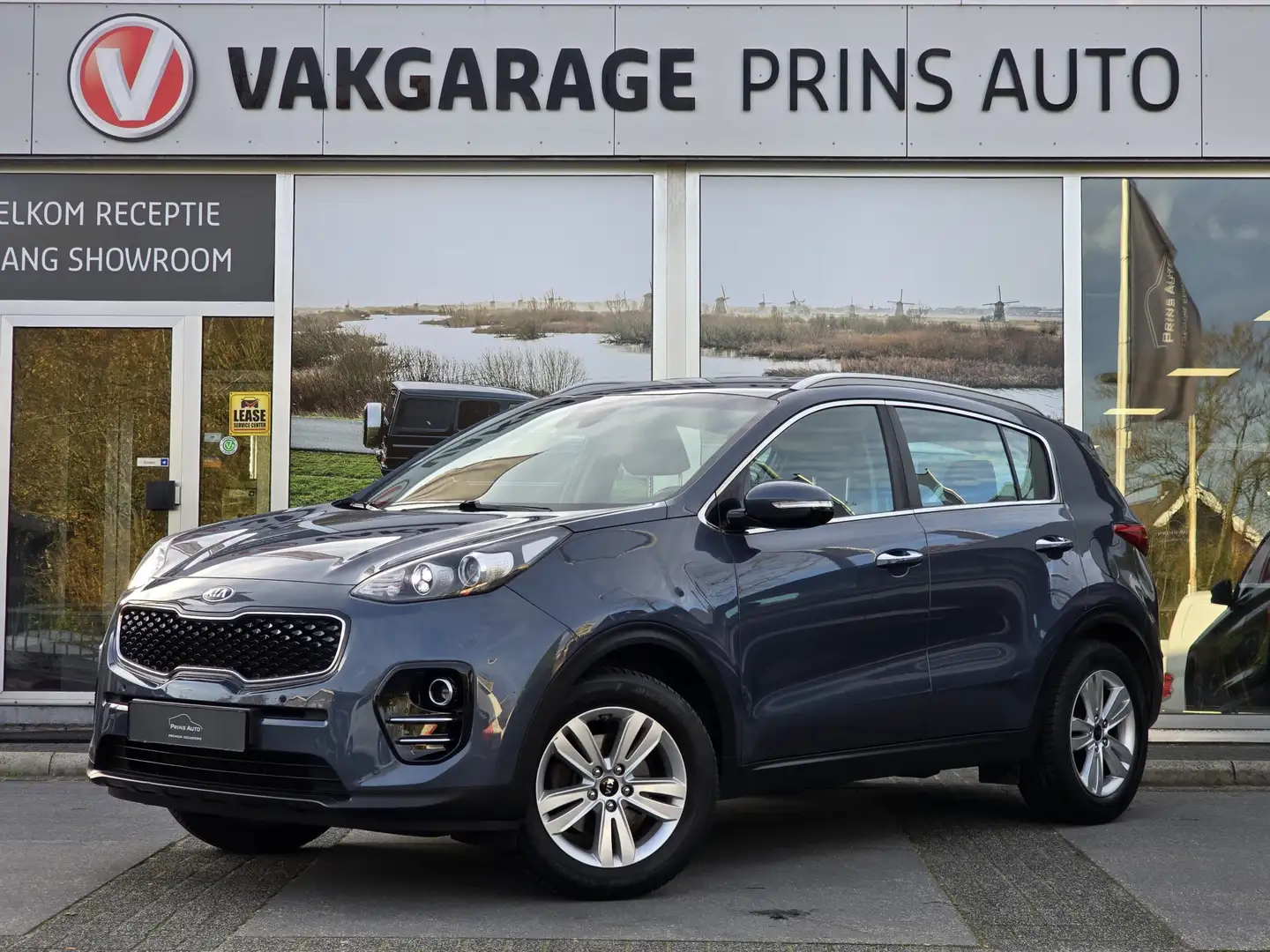 Kia Sportage 1.6 GDI ComfortLine Navigator |TREKHAAK|STUUR+STOE Blauw - 1