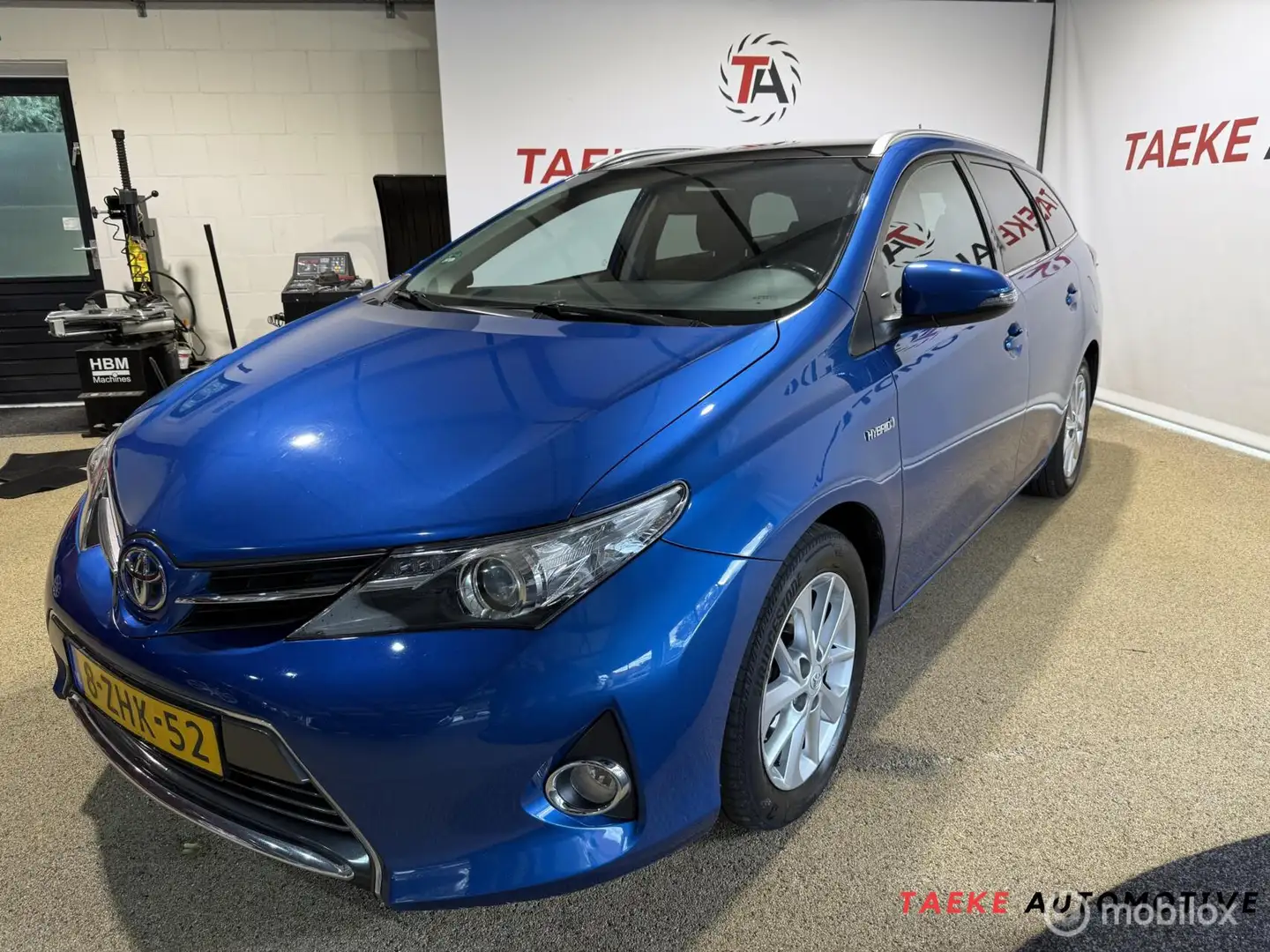 Toyota Auris 1.8 Hybrid Lease Touring Sports Clima/Cruise Blauw - 1