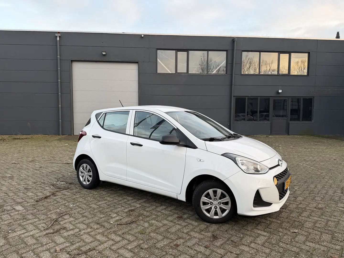 Hyundai i10 1.0i i-Motion 1ste eigenaar! |uitstekende staat| Wit - 1