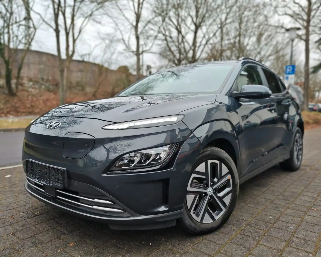 Hyundai KONA E-Kona Trend 64kWh|Wärmepumpe|SOH97%|NAVI|11kW Grau - 1