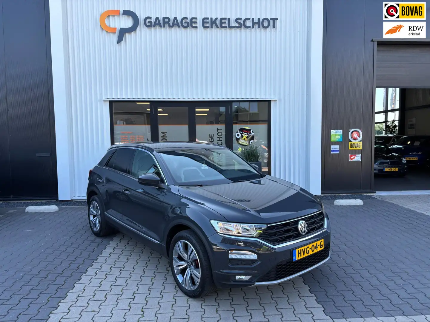Volkswagen T-Roc 1.5 TSI Sport / Camera / Carplay / Navi / Stoelver Grijs - 1